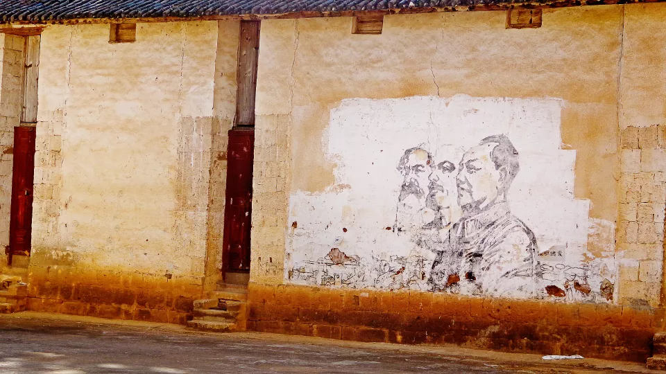 mural of Marx, Lenon and Mao. Photo by Annika Pissin
