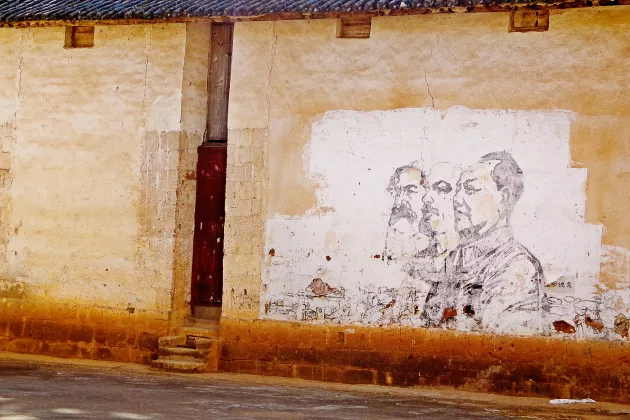 mural of Marx, Lenon and Mao. Photo by Annika Pissin
