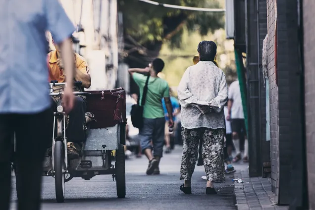 People in an alley in Beijing. Photo by zhang kaiyv on unsplash.com