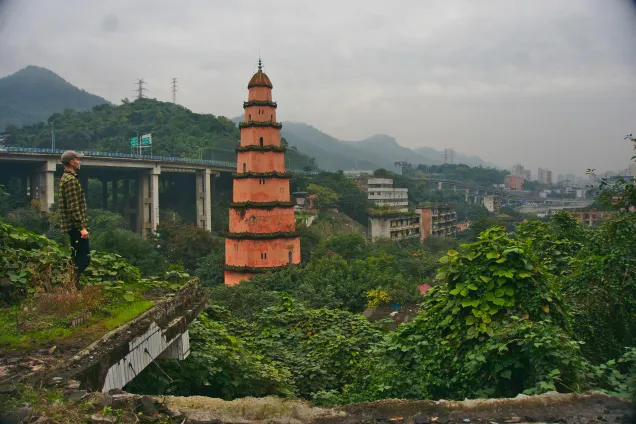 old pagoda in foreground, modern Chinese city in background